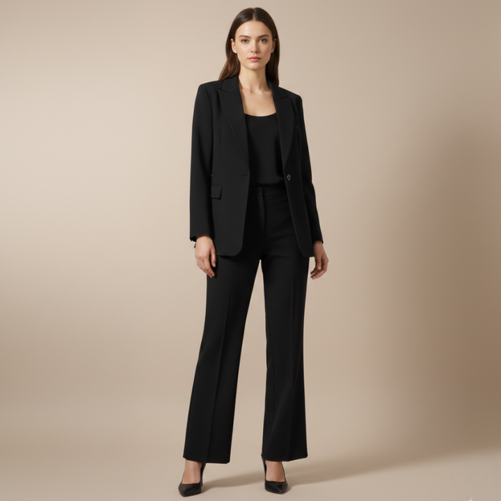 Woman wearing a black suit on a beige background