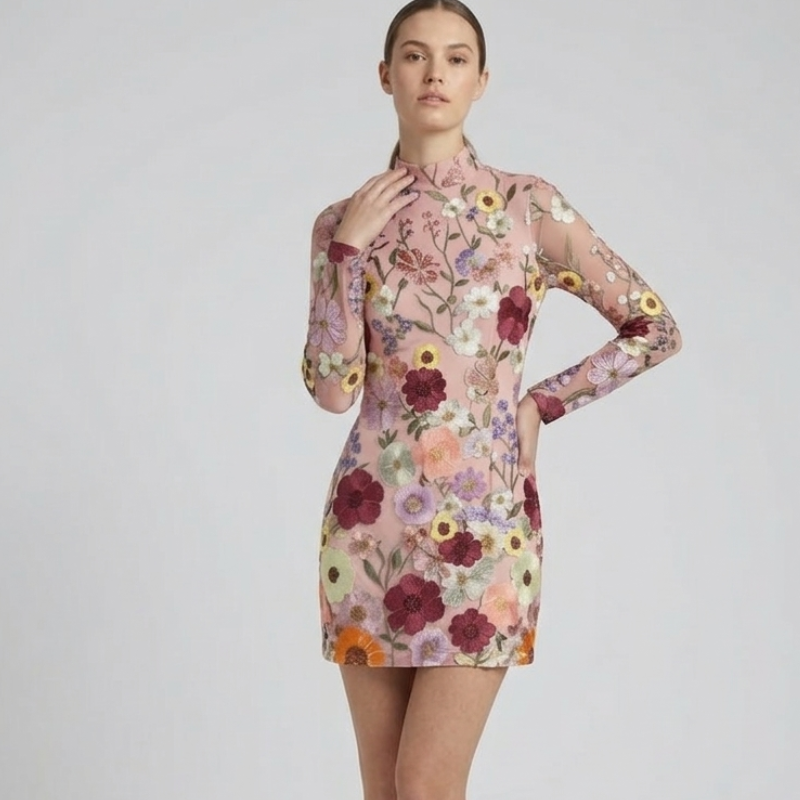 Woman wearing a floral dress on a plain background