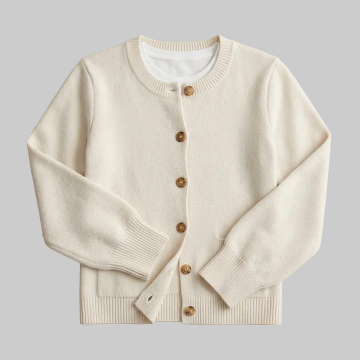 Flat lay of a cream crew-neck cardigan with brown tortoiseshell-style buttons.
