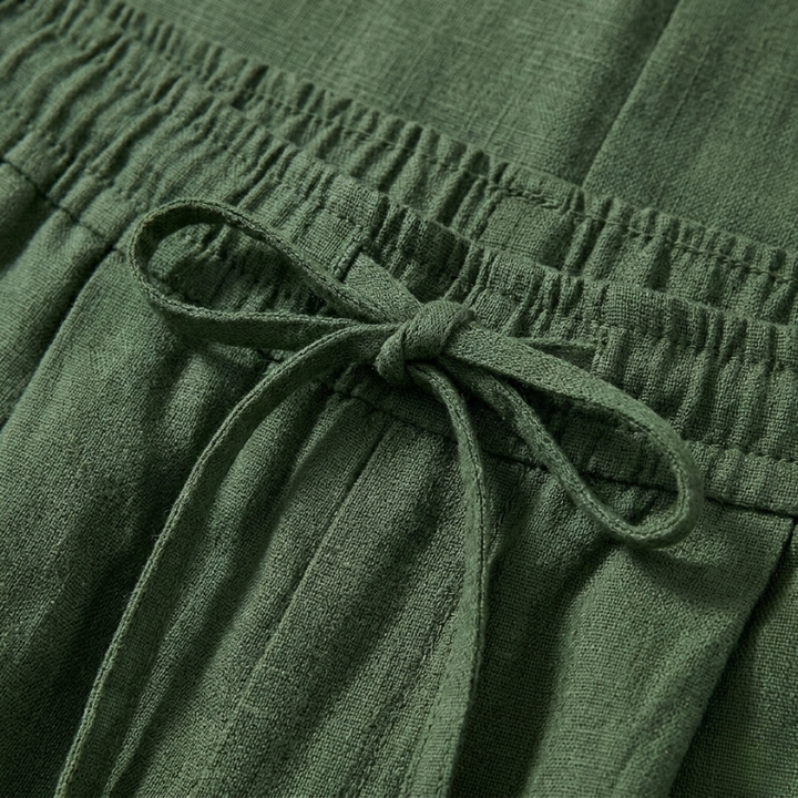 Close-up of green fabric with a tie detail