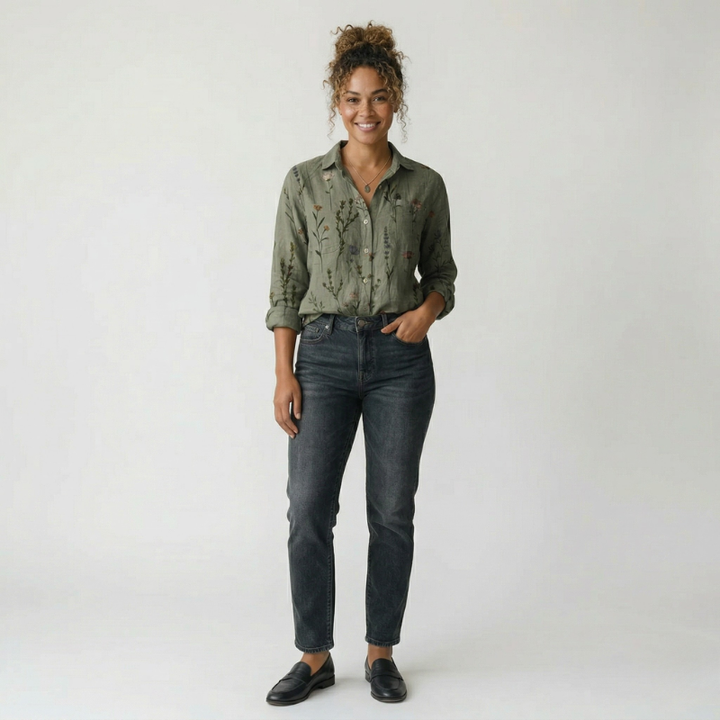 Model wearing a classic olive green button-up shirt with dark gray jeans and black loafers.