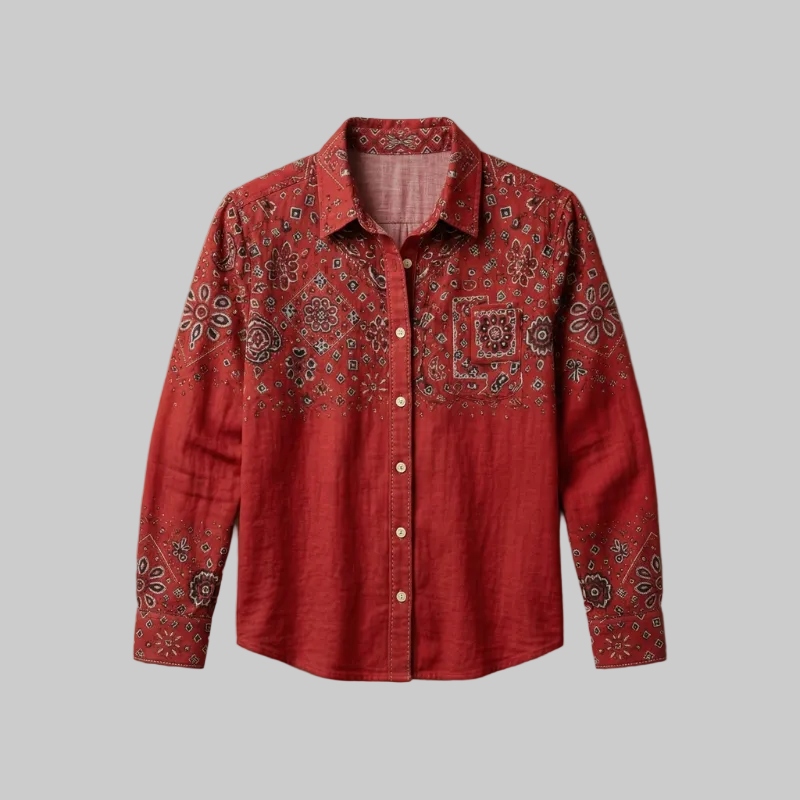Flatlay studio shot of a red long-sleeve shirt featuring detailed embroidery on the chest and sleeves.